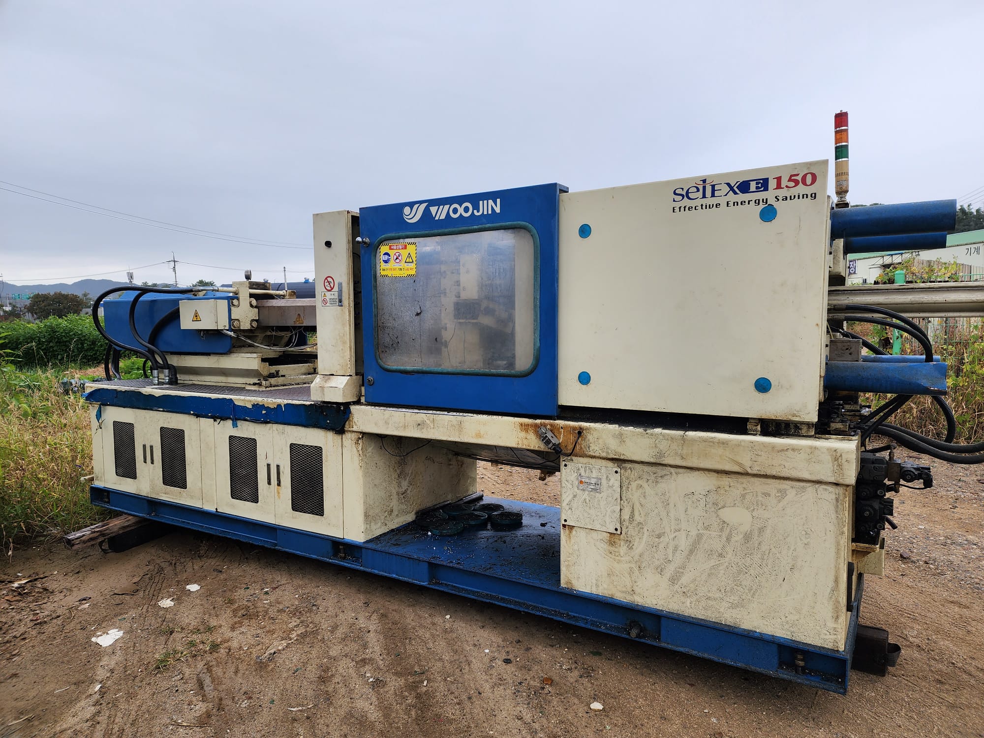 Woojin 150-ton injection molding machine for sale